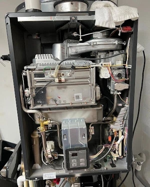 Detailed view of an indoor heating system showing internal components and wiring.