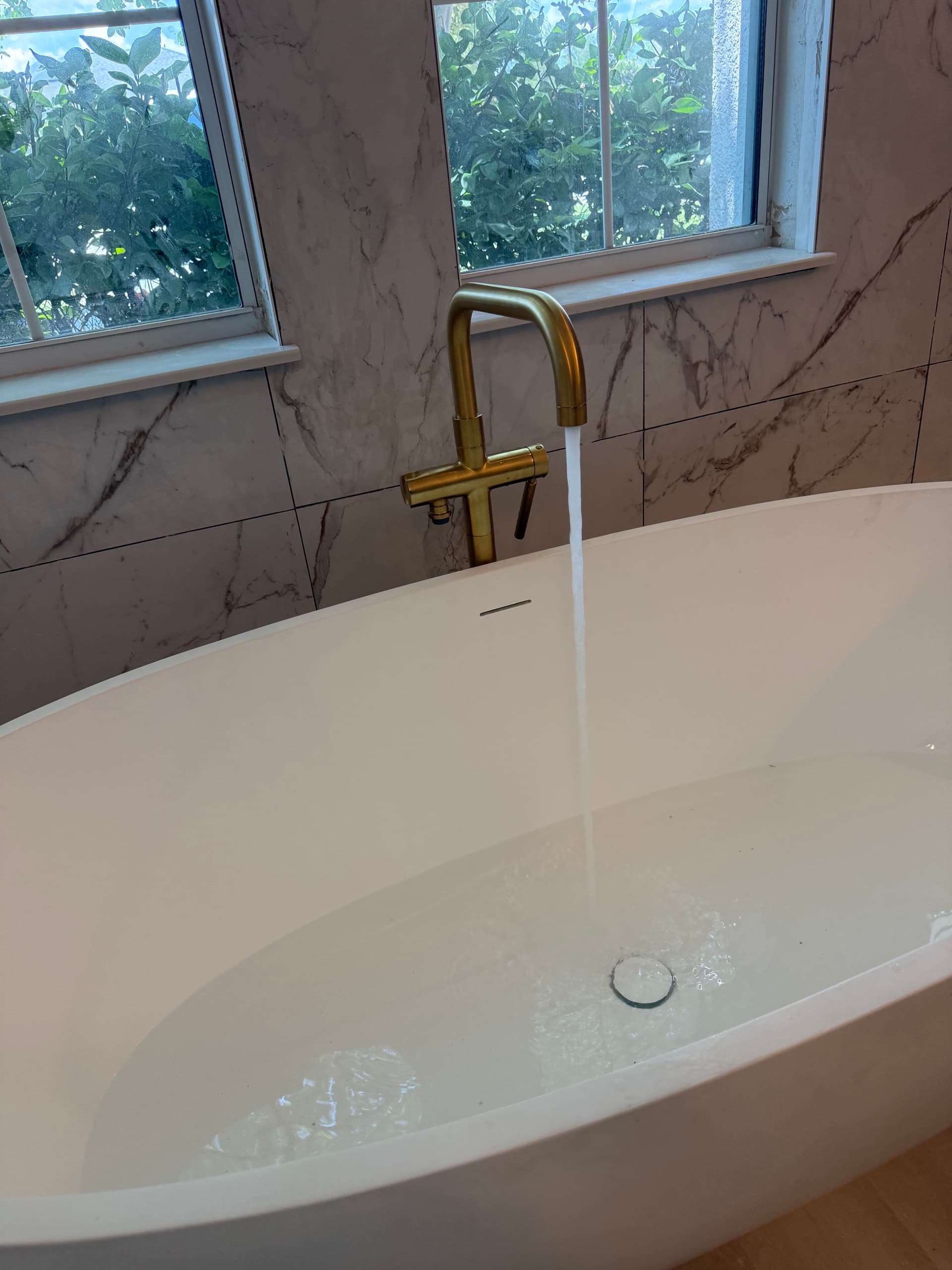 Gallery photos for 300 lb Stone Resin Tub Install with Kohler Gold Brass Fixtures: Image #1